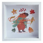 White photo frame featuring an autumn-themed watercolor design with a bear wearing a green scarf surrounded by colorful leaves.