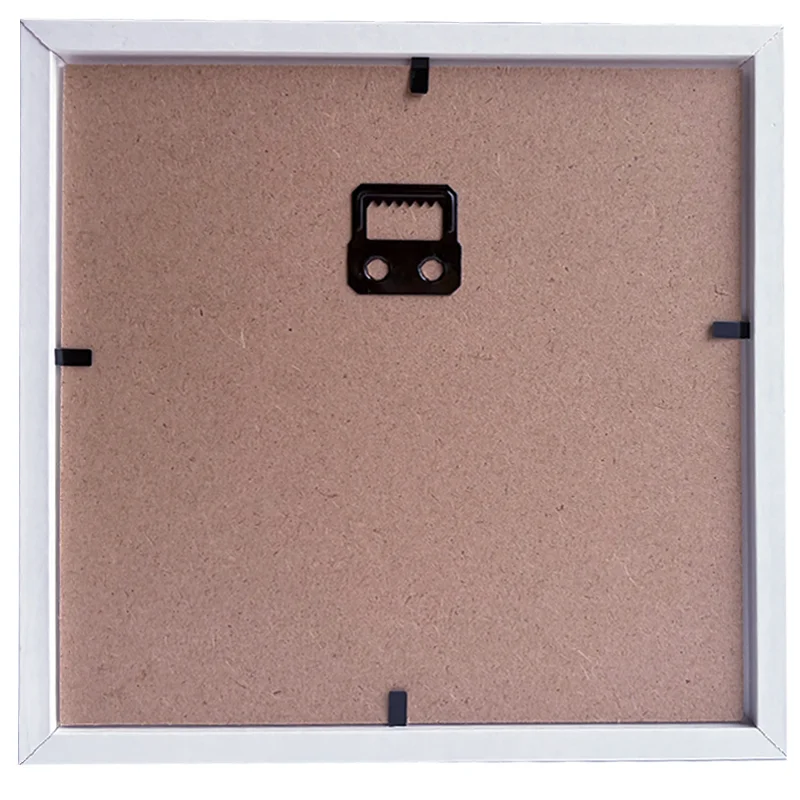 Back panel of a rectangular photo frame with MDF backing, black corner clips, and a wall-mount hook in the center.