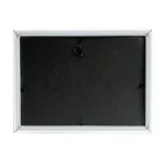 Back panel of a rectangular photo frame with a black surface, securing tabs, and a triangle hanging hook for wall mounting.