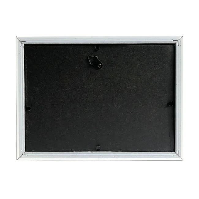 Back panel of a rectangular photo frame with a black surface, securing tabs, and a triangle hanging hook for wall mounting.