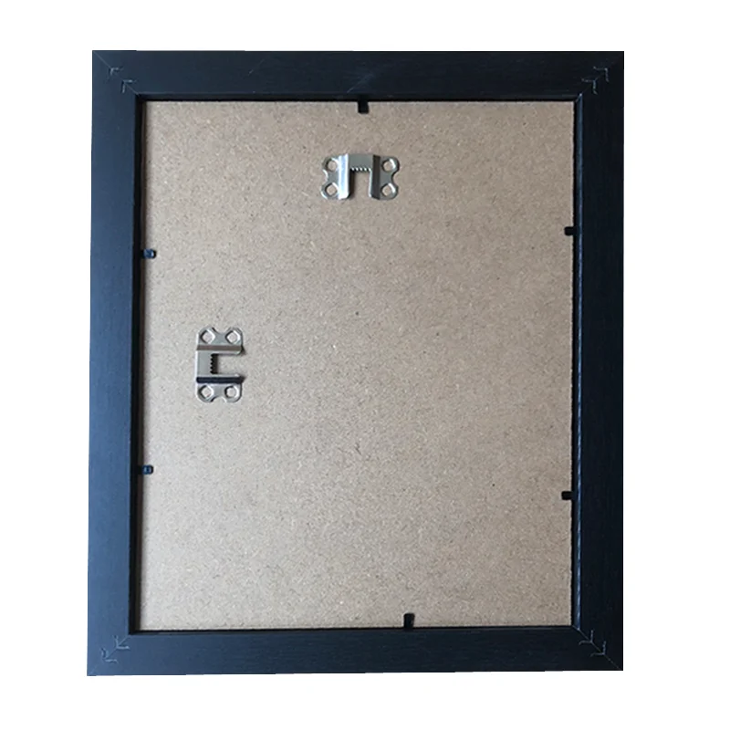 Back view of a black photo frame showing the MDF backboard and metal mounting hooks.