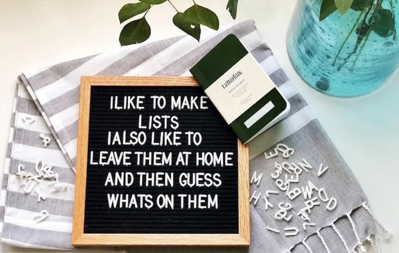 Marketing Value of Felt Letter Boards A person taking a photo of their styled felt letter board for social media