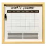 A weekly planner board with a wooden frame, days of the week printed at the top, a note section at the bottom, and a marker attached on the side.