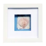 A white square photo frame featuring a seashell and a small starfish on a textured fabric background with blue accents.