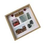 A square wooden collage photo frame featuring four photo slots with decorative images and a 'HOME' sign with heart embellishments.