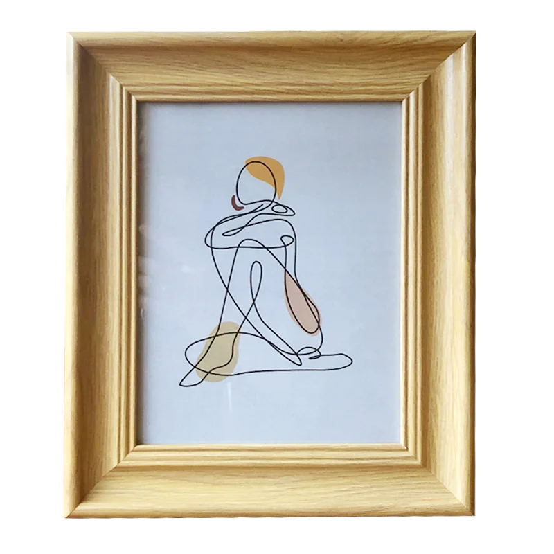 Light brown wooden photo frame displaying minimalist line art of a seated figure, featuring soft earthy tones on a white background.
