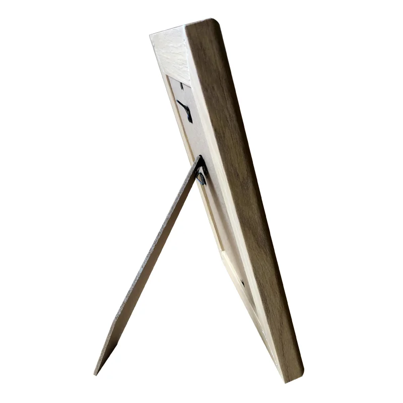 Side view of a beige wooden photo frame with a sturdy stand and sleek design.