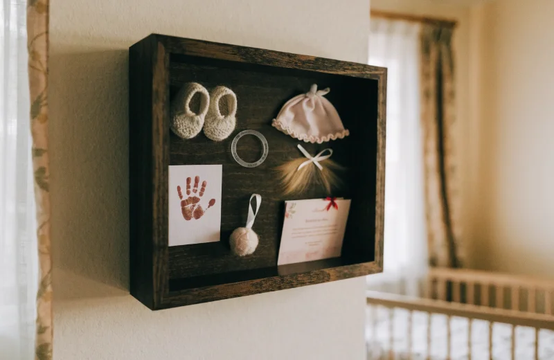 Shadow Box for Baby Memories A shadow box filled with baby's first shoes and hospital bracelet