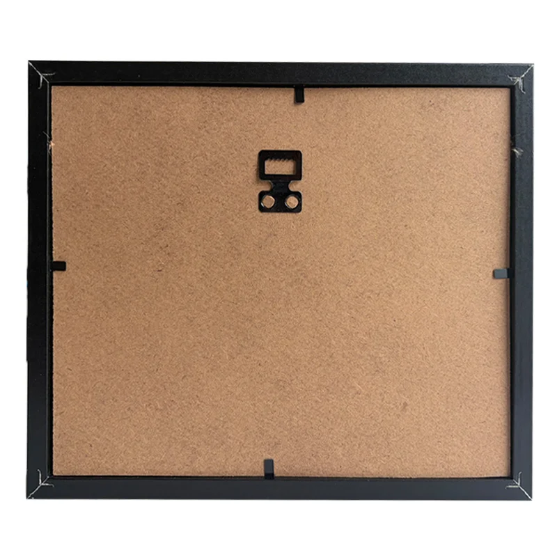 Rear view of a black photo frame with MDF back panel, a metal wall hanger, and corner fasteners for secure assembly.
