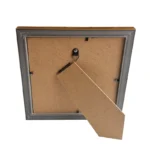 Back view of a rectangular photo frame with MDF backing, a wall mount hook, and an adjustable stand.