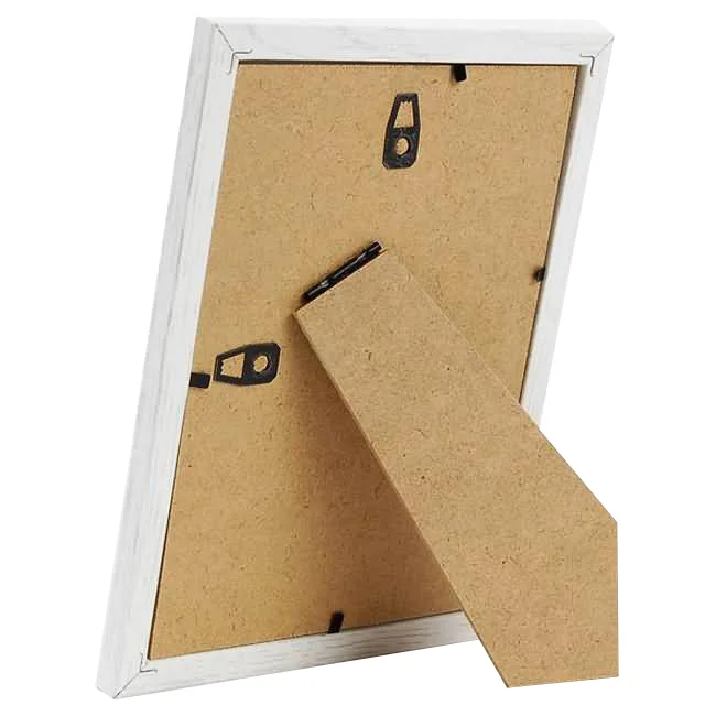 Back view of a white photo frame featuring MDF backing, a sturdy stand, and hooks for wall mounting.