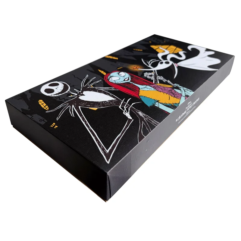 A black-colored rectangular gift box with artistic Nightmare Before Christmas-themed design featuring animated characters.