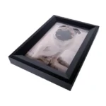 Black rectangular photo frame with a portrait of a pug dog inside, displayed on a white background.