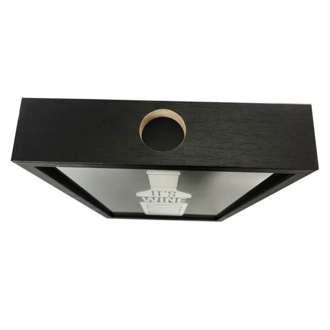 Black shadow box frame featuring a wine-themed artwork inside, with a circular hole for mounting or hanging.