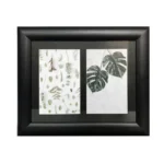 Black wooden photo frame featuring double slots with botanical prints of leaves and greenery on a white background.
