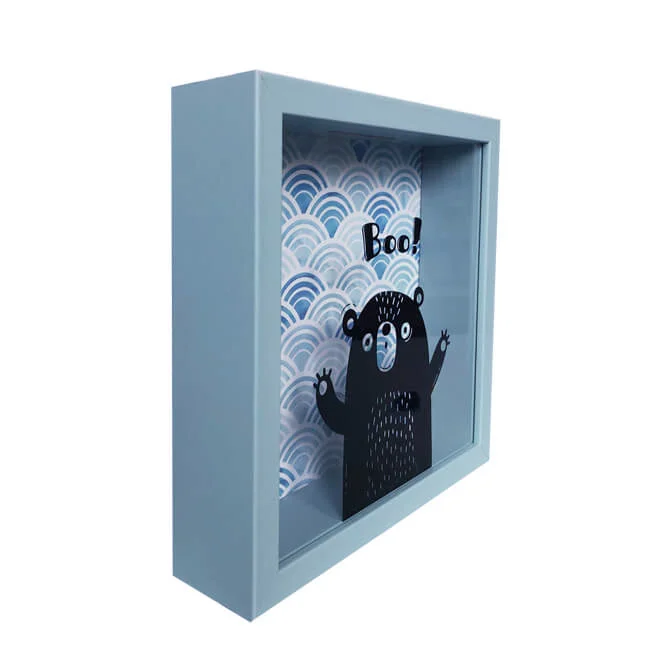 Light blue shadow box frame featuring a playful bear design with wavy patterned backdrop, perfect for home decor or gifting.