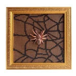 Ornate gold photo frame showcasing a textured spider-themed art design with a 3D spider figure on web-like mesh.