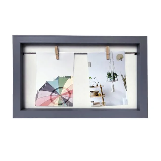 Minimalistic gray photo frame with a built-in string and small clothespins holding two photos for display.
