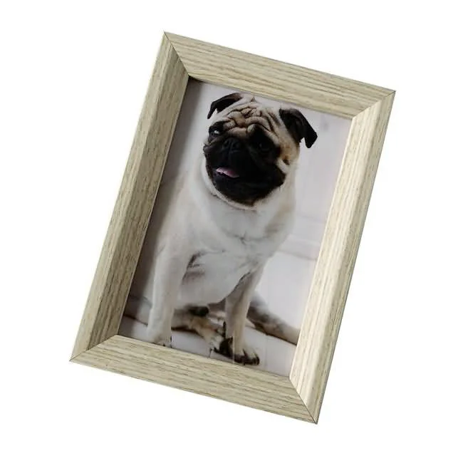 Light wooden photo frame displaying a portrait of a pug sitting and looking forward.