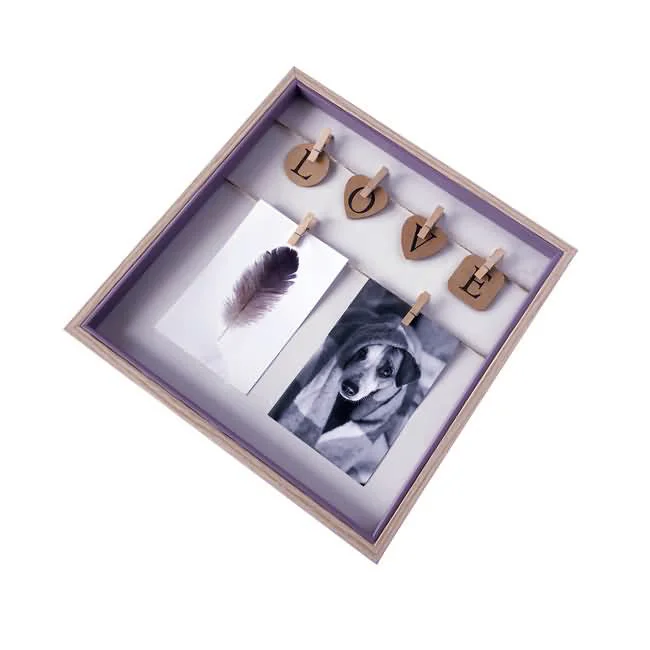 Square photo display frame featuring wooden heart cutouts spelling 'LOVE' with two hanging photos clipped below.