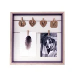 Square photo frame with LOVE letters on heart-shaped clips holding a feather photo and a dog photo.