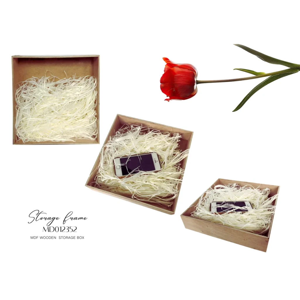 MDF wooden storage box filled with white shredded filler, shown with and without a smartphone inside. Red tulip above the box.