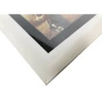 Close-up view of a sleek modern white photo frame with a glossy black inner border showcasing a partial photograph.