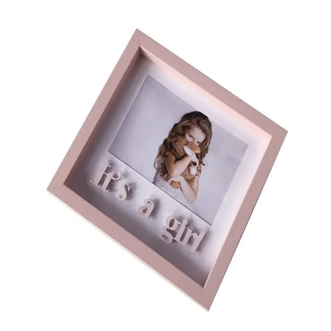 Pink shadow box frame displaying a young girl and the text 'It's a Girl,' designed for baby or kids themed decor.