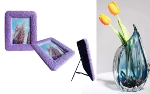 Two purple textured photo frames with tree images and a decorative glass vase holding yellow tulips on a white background.