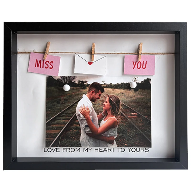 Black photo frame displaying a couple embracing on railroad tracks with 'Miss You' decorations and 'Love from my heart to yours' text.