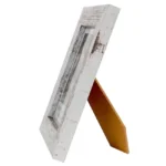 Side view of a rustic white wooden photo frame with distressed finish and supportive back stand.