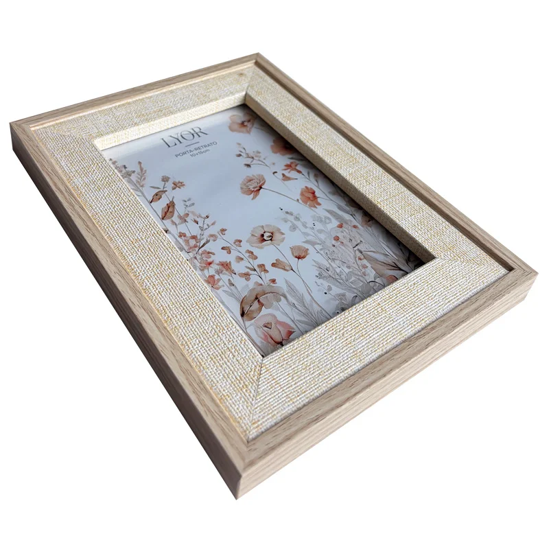 Elegant wooden photo frame with a textured edge, featuring a floral design and a neutral palette for decor.