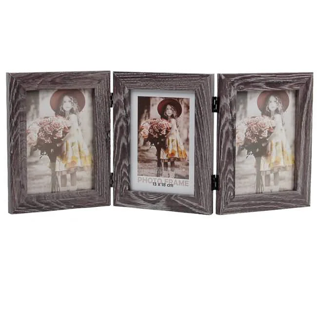 Triple-fold wooden photo frame with hinged panels in dark wood grain finish, displaying three 13x18 cm photos of a girl holding flowers.