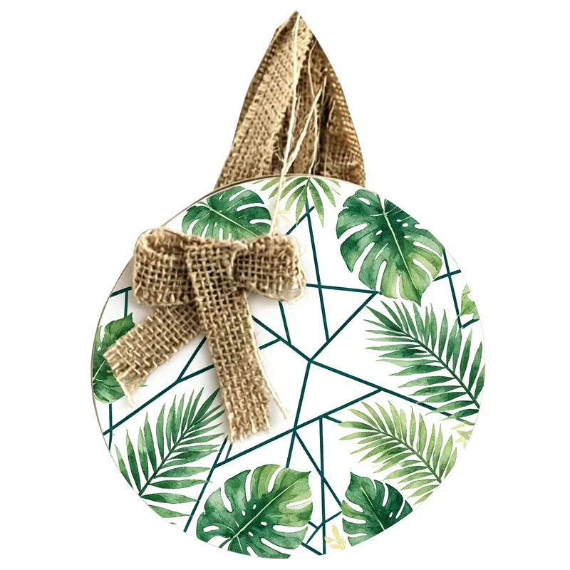 Round hanging decor with green tropical leaf pattern, geometric accents, and burlap bow on a string.