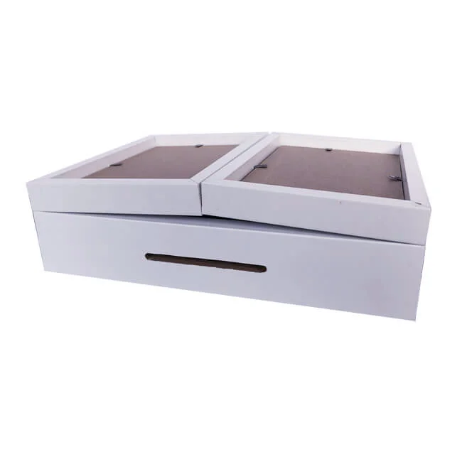White dual photo frame designed as a hinged lid atop a storage box, combining functionality with decorative appeal.