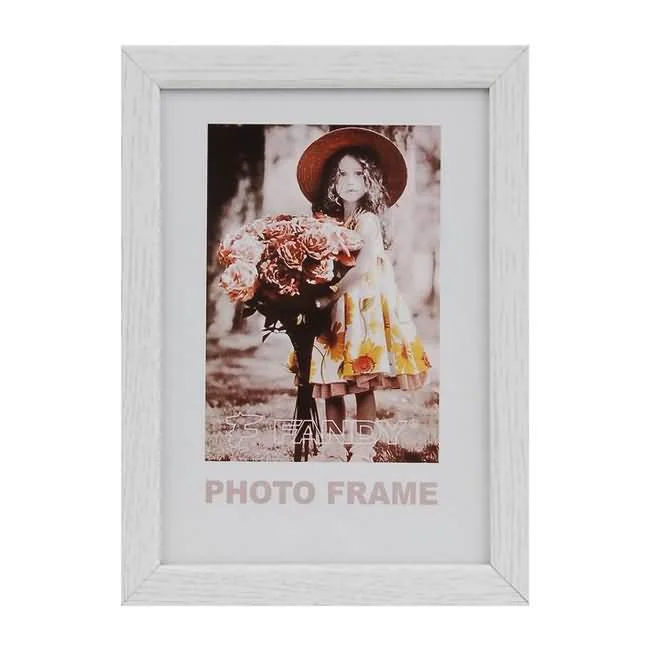 Vertical white photo frame with a displayed image of a young girl wearing a hat and holding a large flower bouquet.