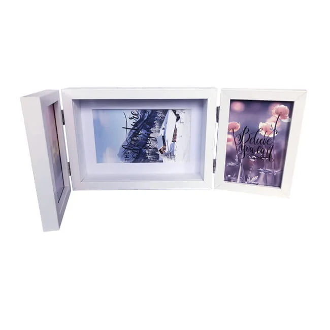 White trifold photo frame displaying three decorative images, including flowers and snowy scenery, ideal for home decor.