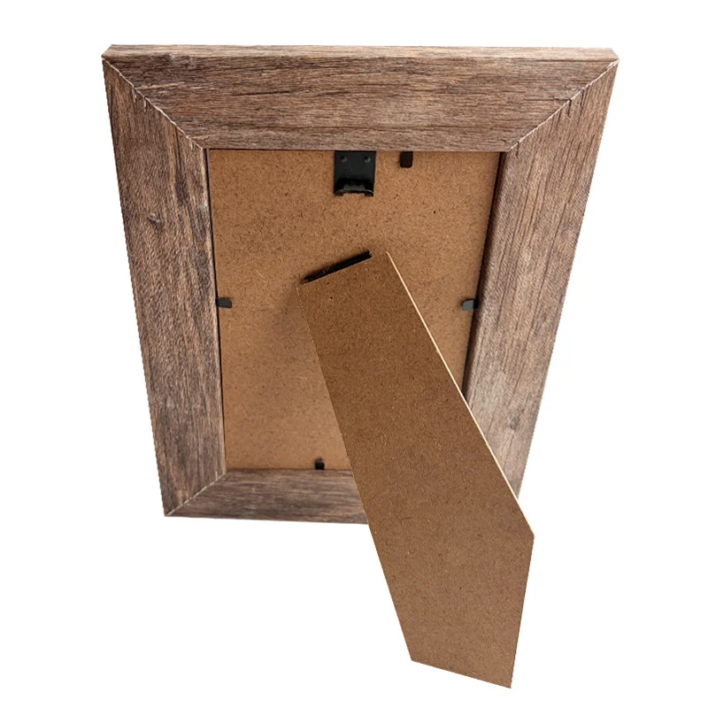 A wooden photo frame with a rustic finish, showing its back side with an easel-style stand and wall-mounting hook.