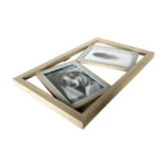 A wooden multi-photo collage frame with spaces for two photos, featuring an image of a dog and a feather. Sleek and modern design.
