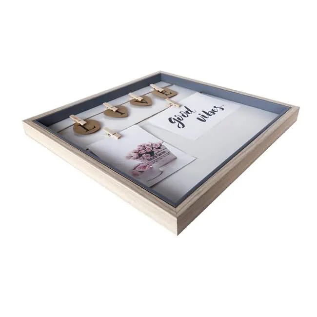 Wooden photo frame with a clip display design featuring small wooden clips holding photos and a message saying 'Good Vibes'.