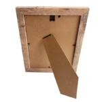 Back view of a wooden photo frame with MDF backing and a foldable stand, showcasing rustic design and functionality.