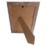 A wooden photo frame viewed from the back, featuring an MDF stand for tabletop placement and a durable hanging clip.