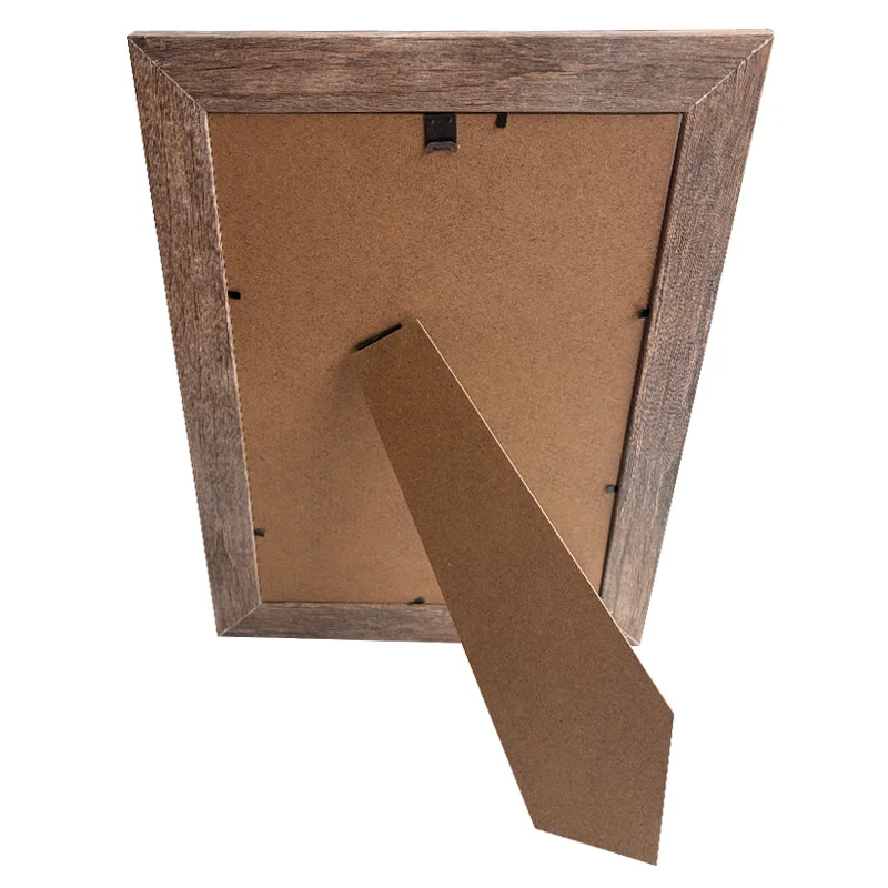 A wooden photo frame viewed from the back, featuring an MDF stand for tabletop placement and a durable hanging clip.