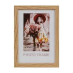 A rectangular wooden photo frame displaying an image of a girl holding flowers. Ideal for home decor or gift.