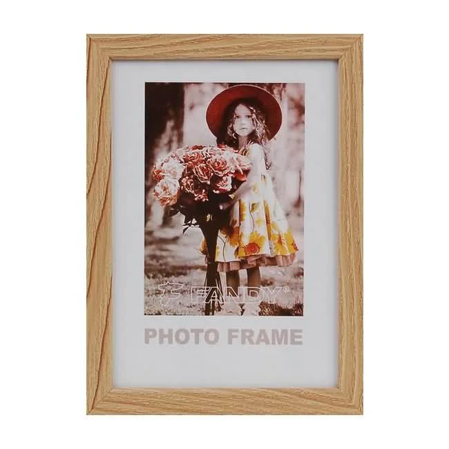 A rectangular wooden photo frame displaying an image of a girl holding flowers. Ideal for home decor or gift.