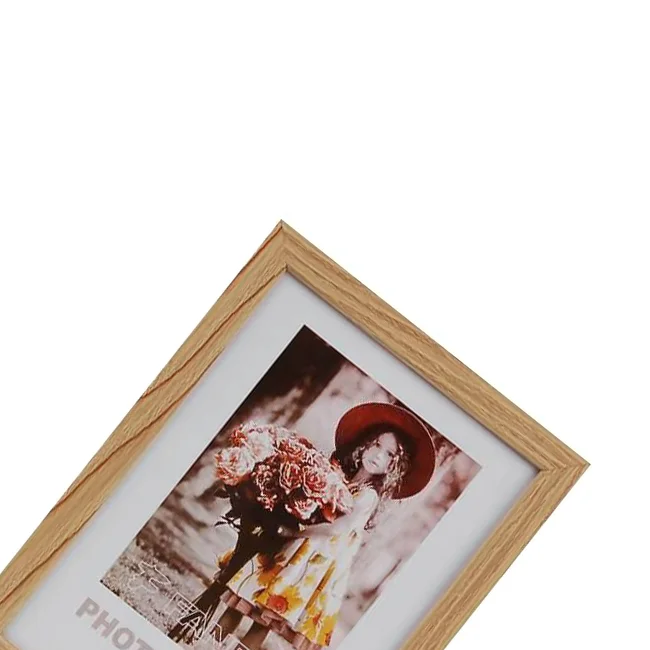 Wooden photo frame with a vintage-style photo of a woman holding flowers, featuring a natural wood finish and white border.