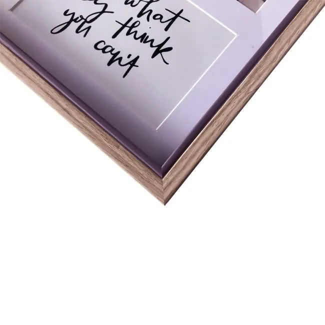 Corner view of a wooden photo frame displaying an inspirational quote, featuring clean and modern design.