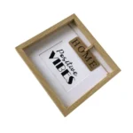 A wooden photo frame with a white background, displaying the words 'positive vibes' and a small wooden tag with 'HOME' clipped inside.