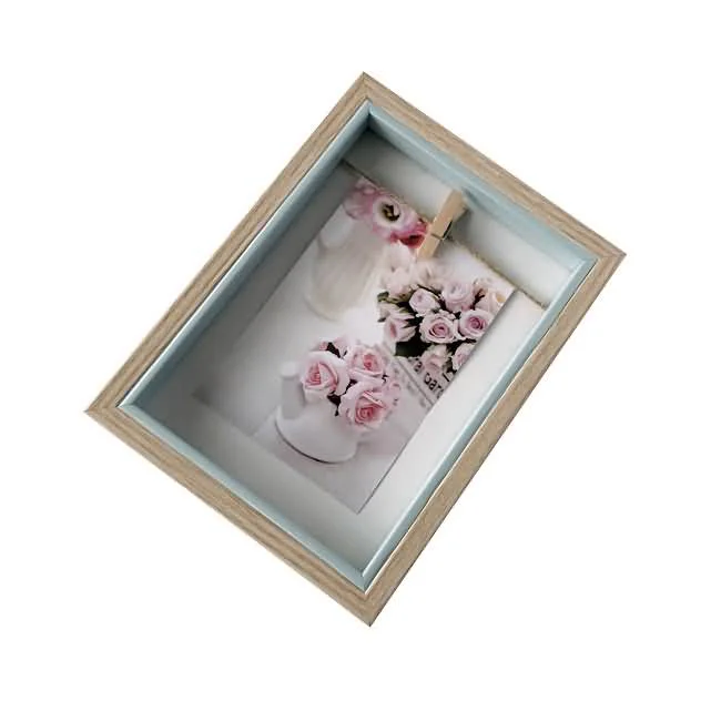 Beige wooden picture frame with a delicate floral photo featuring pink roses and a soft blue interior border.