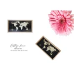 Wooden collage frame with world map design on a black background. Includes a pink flower as decoration.